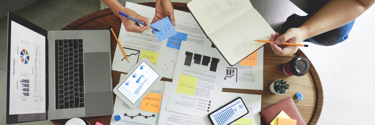 Business people writing on sticky notes for colleagues thinking strategy business plan or over problem in coworking office, Diverse Brainstorm Business Meeting Concept